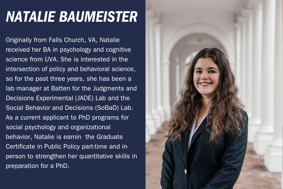 Natalie Baumeister headshot - woman in blue jacket standing in front of white columns